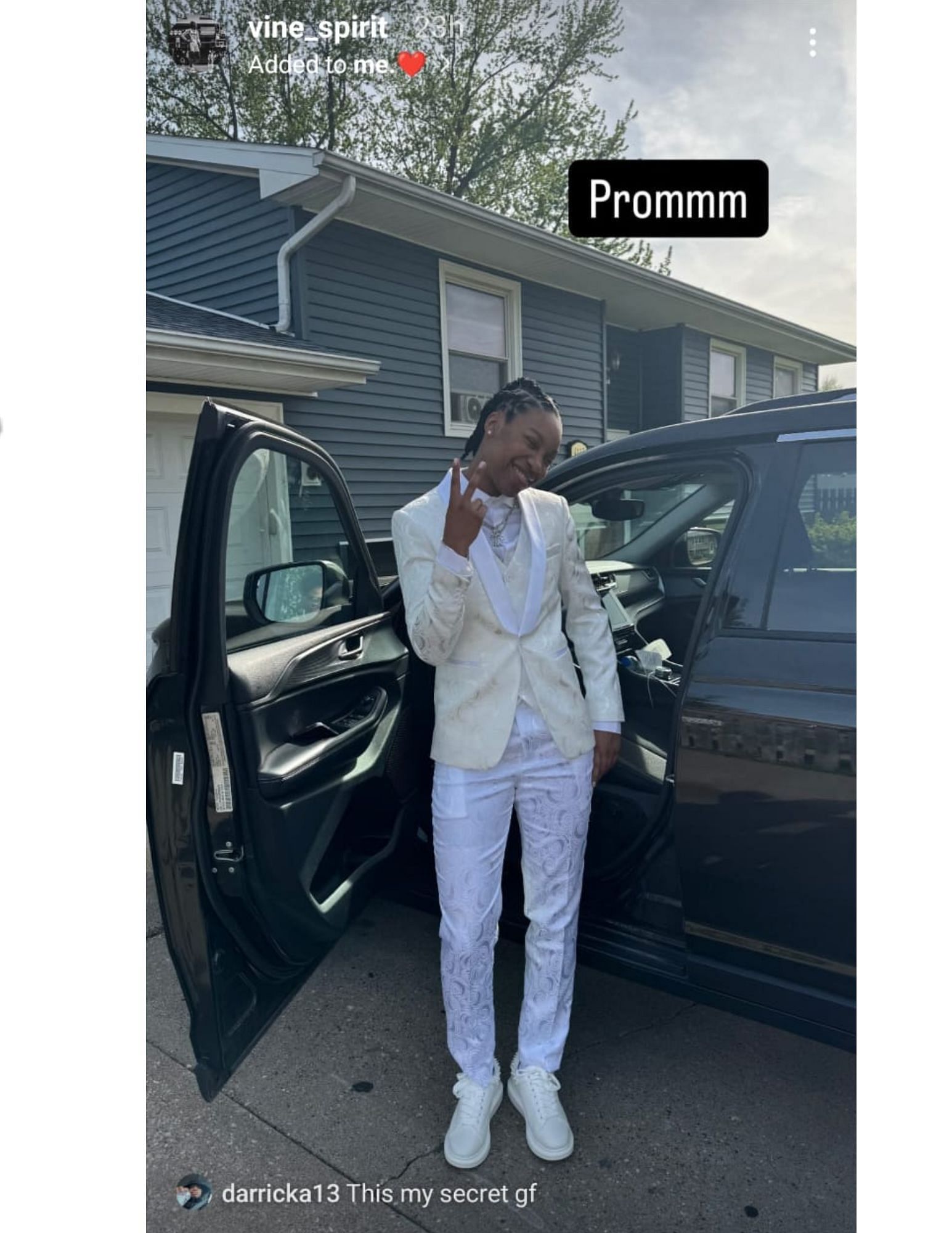 Divine Bourrage shares a look at her all-white outfit as she heads prom via Instagram.